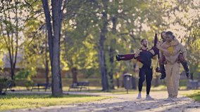 Young, diverse friends and couples enjoy a day out in a vibrant park. They laugh, smile, and express their joy by carrying each other and giving piggyback rides. - Powered by Shutterstock - Get 15% off with code: PIKWIZARD15