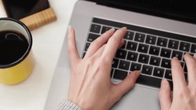 Close-up top view of woman hands typing on a laptop keyboard, focusing on digital workspace, symbolizing work, study, and modern online communication. - Powered by Shutterstock - Get 15% off with code: PIKWIZARD15