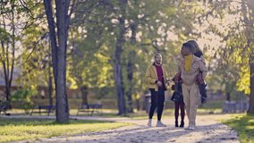 A vibrant group of diverse friends enjoys a joyful day in the park. Two men playfully give piggyback rides and lift their female friends, sharing laughter and happiness on a sunny afternoon. - Powered by Shutterstock - Get 15% off with code: PIKWIZARD15