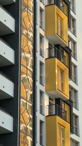 sun glare on the wall, sunbeams on the house, sun glare on the windows, beautiful play of light on the house, multi-storey house, multi-storey houses on a sunny day, large windows, very beautiful hous