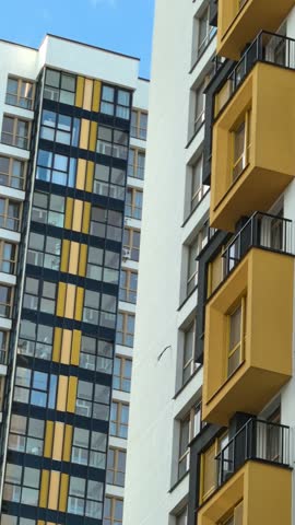 sun glare on the wall, sunbeams on the house, sun glare on the windows, beautiful play of light on the house, multi-storey house, multi-storey houses on a sunny day, large windows, very beautiful hous
