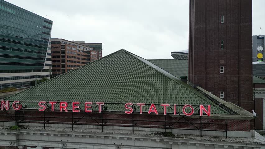 Seattle King Street Station in downtown seattle drone aerial in winter, lumen field and seattle skyline