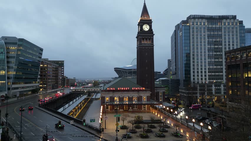 Seattle King Street Station in downtown seattle drone aerial in winter, lumen field and seattle skyline