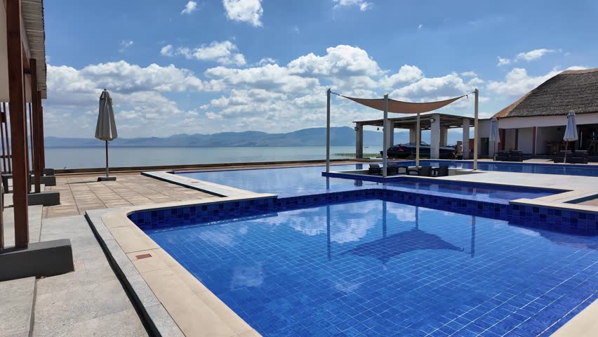 Mponda Malawi Africa. 01.12.2025. Video.  Hotel swiiming pool on Lake Malawi at Mponda southern Malawi Africa.