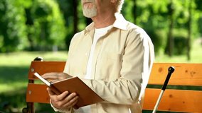 disabled blind person read braille book world braille day - Powered by Shutterstock - Get 15% off with code: PIKWIZARD15