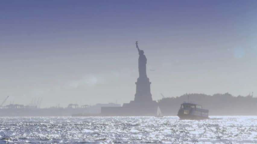 Statue of Liberty stands proudly in New York Harbor, sunlight reflecting off water. Boat glides by, showcasing iconic American landmark. Perfect for diverse projects.