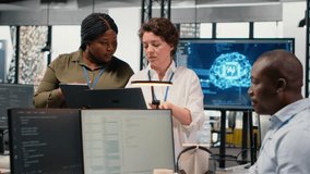 Programmers in office automating workflows using artificial intelligence technology. Teamworking colleagues refining deep learning computational models for faster processing, camera B - Powered by Shutterstock - Get 15% off with code: PIKWIZARD15