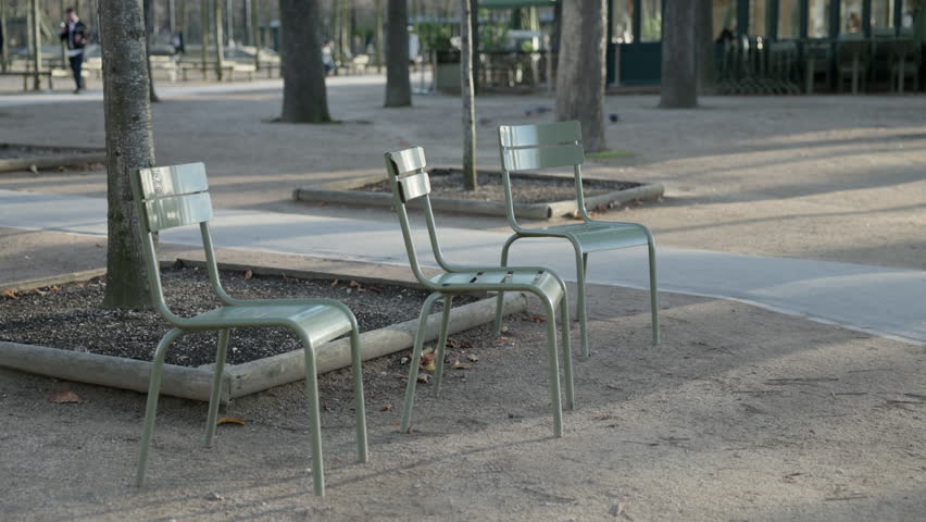 Paris France Parc du Luxembourg Featuring Three Empty Chairs in Focus
