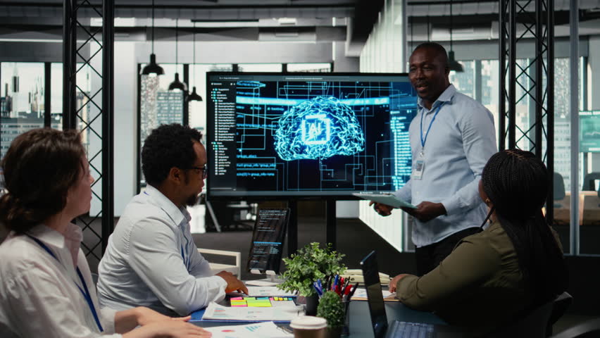 Programmer gives presentation to executives, implementing AI chatbot reducing work volume. Startup office IT expert analyzing business insights for management using artificial intelligence, camera A