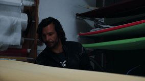 Surfboard shaping process captured with craftsmanship and skill - Powered by Shutterstock - Get 15% off with code: PIKWIZARD15