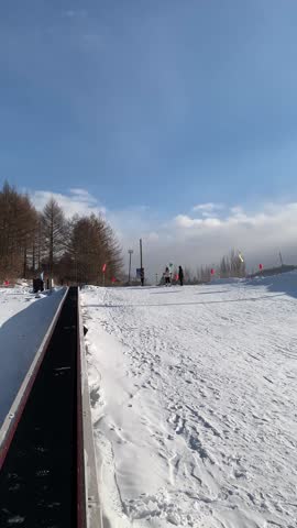 Winter and outdoor fun snowy activities, ski, tube slide, snow mobile, banana boat ride at Snow Valley, China 