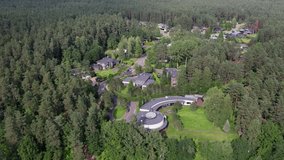 Green suburban area in Vilnius with forest trails, calm residential streets, and nature-rich living captured from above in Laurų kvartalas. - Powered by Shutterstock - Get 15% off with code: PIKWIZARD15