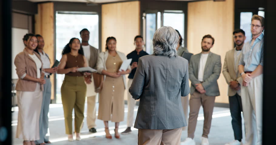 Manager, training group and orientation in office for company policy, introduction and job overview. Mentor, back of mature person and interns at induction for onboarding and employee responsibility