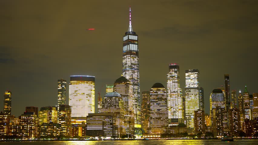 New York City at night. NYC skyline. Manhattan New York buildings skyscraper. New York famous building. New York City Skyline. Manhattan view in NY. Sunset in NYC. NY city reflected in Hudson water.