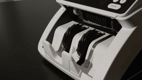 Hundred dollar banknotes motion in counting machine. American dollars in cash counter. USD bills. Investment and savings with dollar bills. Hundred dollar notes in banking operation. American currency - Powered by Shutterstock - Get 15% off with code: PIKWIZARD15