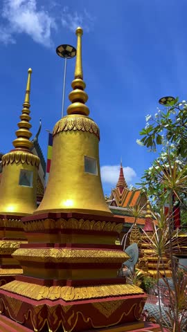 SIEMREAP, CAMBODIA - October 6, 2025: The interior of Wat Preah Prom Rath Temple. A Buddhist temple with statues of cows. A decorative structure made of gold. The main spiritual center of Siemreap. 4К
