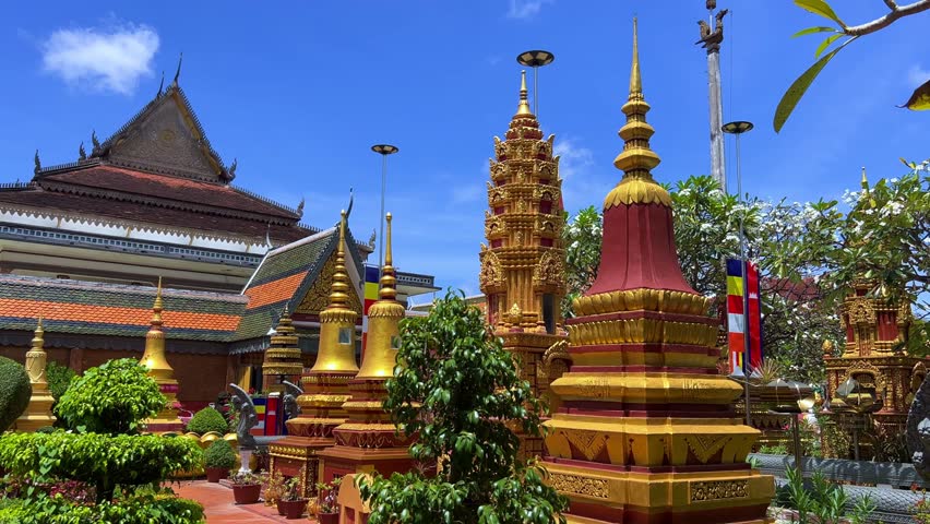 SIEMREAP, CAMBODIA - October 6, 2025: The interior of Wat Preah Prom Rath Temple. A Buddhist temple with statues of cows. A decorative structure made of gold. The main spiritual center of Siemreap. 4К