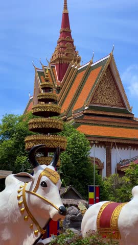 SIEMREAP, CAMBODIA - October 6, 2025: The interior of Wat Preah Prom Rath Temple. A Buddhist temple with statues of cows. A decorative structure made of gold. The main spiritual center of Siemreap. 4К