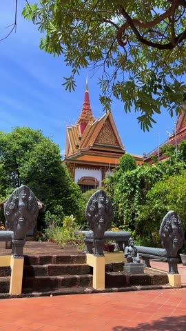 SIEMREAP, CAMBODIA - October 6, 2025: The interior of Wat Preah Prom Rath Temple. A Buddhist temple with statues of cows. A decorative structure made of gold. The main spiritual center of Siemreap. 4К