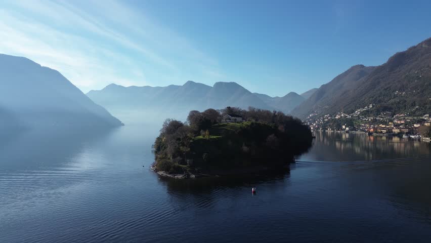 View of Comacina island from the village of Ossuccio on Lake Como