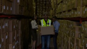 Male worker walking warehouse with box, approach causing network expanding over him mapping stock. Highviz, aisle, storage, teamwork, industrial, logistics, digital - Powered by Shutterstock - Get 15% off with code: PIKWIZARD15