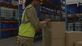 Warehouse worker scanning box with scanner in aisle B, HUD icons orbiting while updating stock. Barcode, inventory, bold, logistics, containers, safety, efficiency - Powered by Shutterstock - Get 15% off with code: PIKWIZARD15