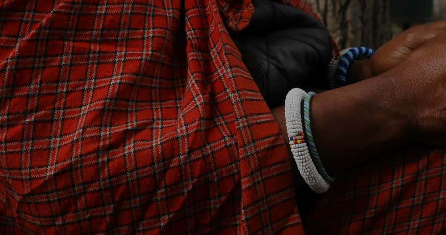 Mature male, phone entering frame, tapping and swiping for data as tech map expanding across lap. Urban, street, candid, device, interface, augmented, reality