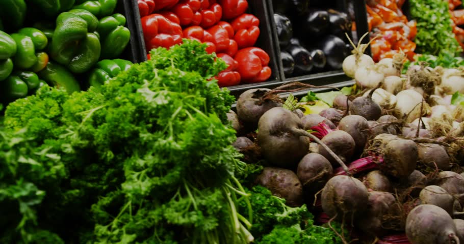 HUD overlay appearing over produce, scanning beets and greens, sliding panels and analyzing metrics. Kale, lettuce, market, vegetables, carrot, garlic, retail