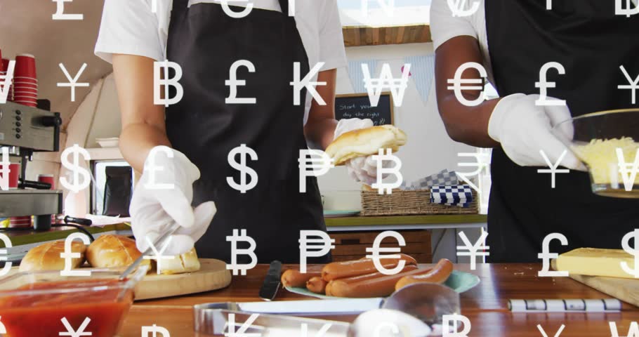 On order food server holding bun while team assembling hotdogs, money symbols drifting onto hands. Vendor, foodtruck, prep, counter, condiment, currency, bustling