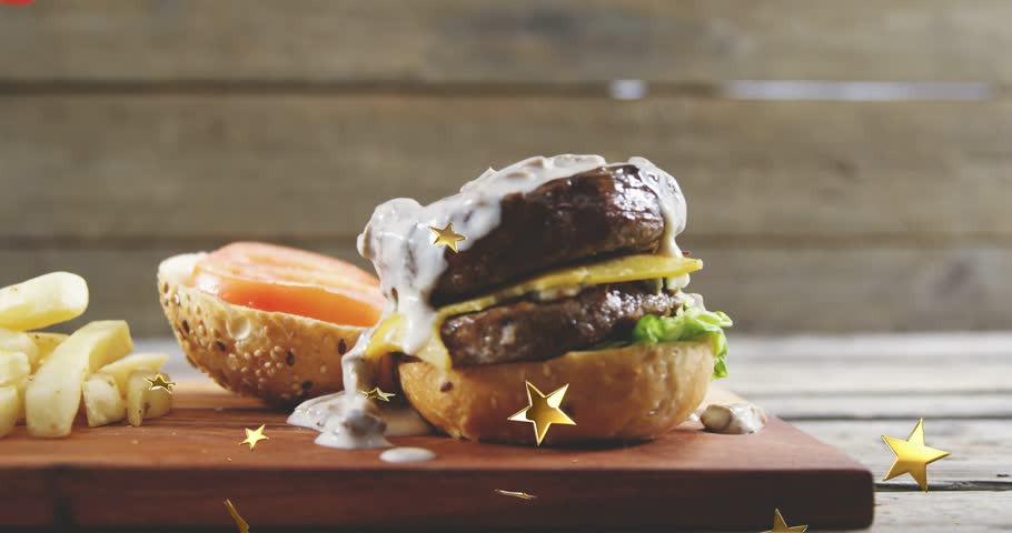 Red squeeze bottle pausing over, pouring ketchup onto fries while burger dripping adding promo glow. Glossy, rustic, appetizing, closeup, potato, confetti, studio