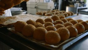 Baker reaching for braided loaf in bakery checking loaf while causing network expanding over rolls. Bread, kitchen, interior, overlay, digital, connectivity, industrial - Powered by Shutterstock - Get 15% off with code: PIKWIZARD15