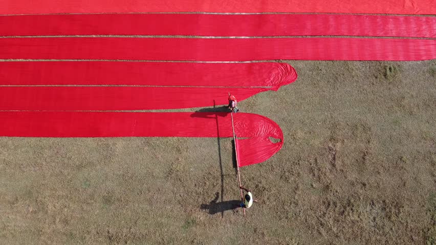 Aerial view of red fabrics drying, Bangladesh.