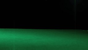 Black six-sided die dropping after release, bouncing then rolling on green felt to show landing. Dice, tabletop, studio, dark, motion, bounce, roll - Powered by Shutterstock - Get 15% off with code: PIKWIZARD15