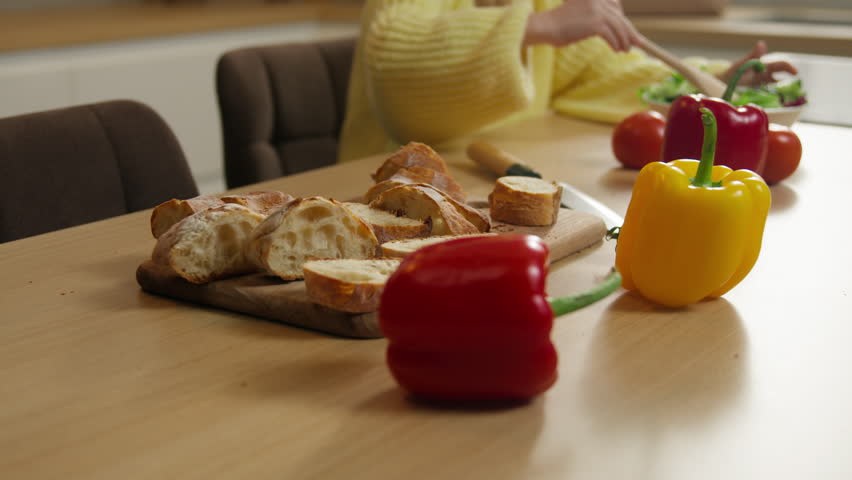 Happy Caucasian family at kitchen 10s little Caucasian girl child kid cooking vegetarian fresh healthy dish breakfast dinner salad mixing vegetables food father come in support hug cuddle daughter