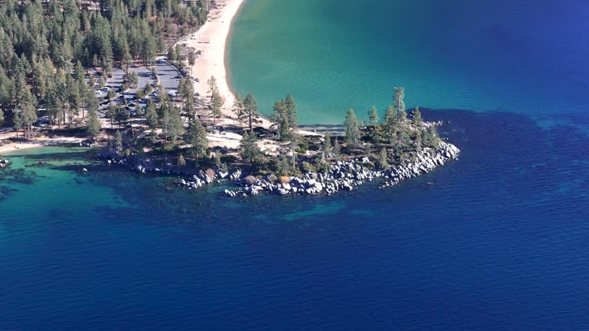 Aerial top down view of Sand Harbor beach with turquoise water and granite rocks in Lake Tahoe