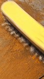 wire brush cleaning rusted flat steel sheet, closeup - Powered by Shutterstock - Get 15% off with code: PIKWIZARD15