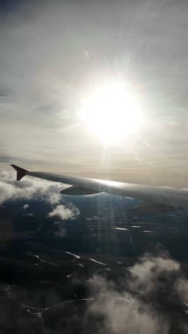 Aerial View from Airplane Window Flying Over Andes Mountains