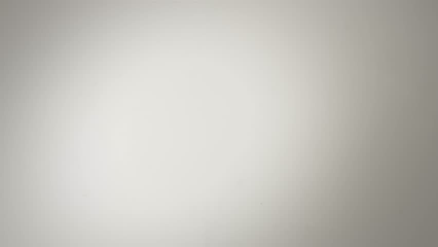 Fresh white milk is poured into a pristine white surface, creating an elegant splash and mesmerizing ripples in stunning slow motion This close up view highlights the liquids smooth, creamy texture