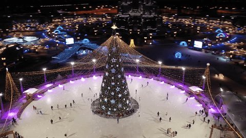 Aerial Circular Drone Shot around Night Skating