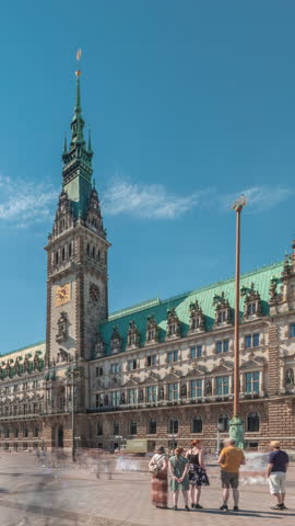 Panorama showing a building of the Hamburg City Hall timelapse, the seat of the government of Hamburg, located in the Altstadt quarter in the city center. View from the main square under a cloudy sky