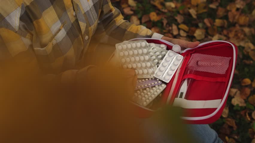 Autumn park. First aid kit. Slow motion.High quality 4k footage