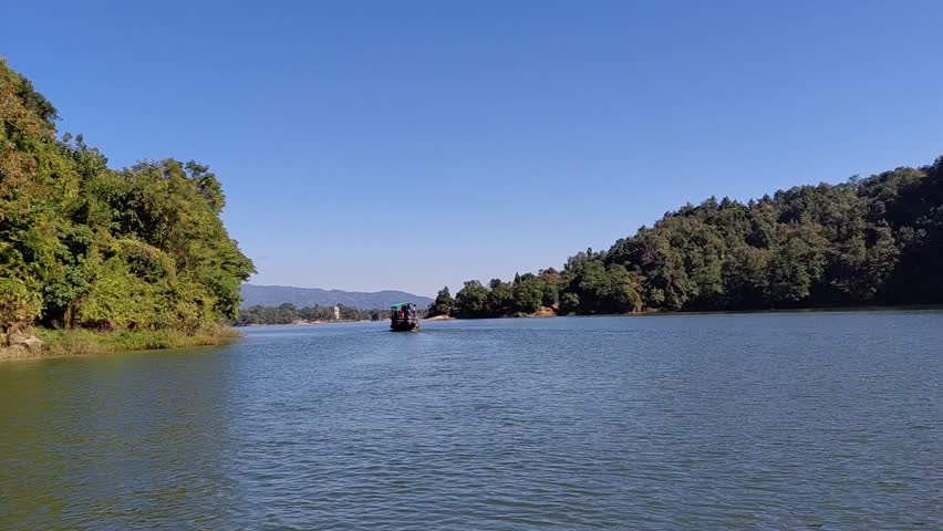 Blue water lake and high mountains beside i