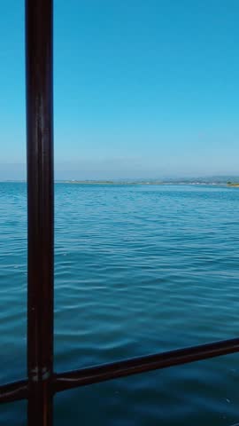 Blue water lake and high mountains beside i