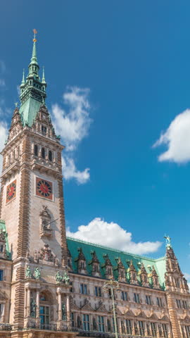 Building of the Hamburg City Hall timelapse, the seat of the government of Hamburg, located in the Altstadt quarter in the city center. Front view from the main square under a cloudy sky