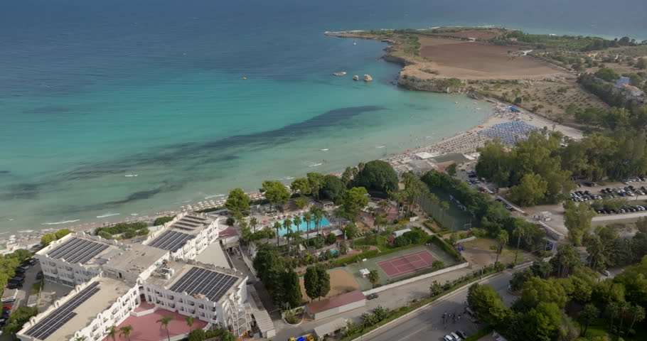 Aerial view of hotels and resorts in Fontane Bianche, located near Cassibile in the province of Syracuse, Sicily, Italy. It is a tourist destination overlooking a turquoise and crystal clear sea.