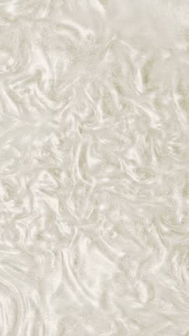 Liquid white gold pearl motion organic background. Shine glitter fluid metallic color paint. Texture abstract acrylic cloud swirling underwater. Vertical.