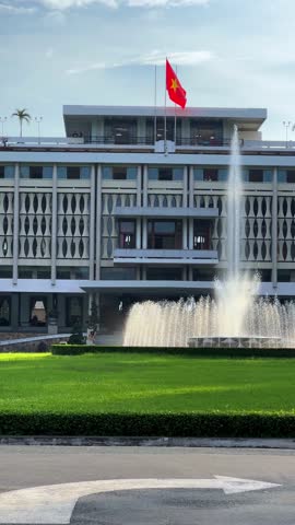 Ho Chi Minh City, Vietnam - September 18, 2025: View of the Independence or Reunification Palace, formerly Saigon. Dinh Choc Lop. A beautiful fountain sprays in front of the palace in bright daylight.