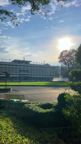 Ho Chi Minh City, Vietnam - September 18, 2025: View of the Independence or Reunification Palace, formerly Saigon. Dinh Choc Lop. A beautiful fountain sprays in front of the palace in bright daylight.