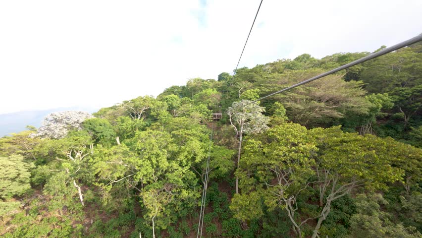 Sliding down a zip line in first person view.