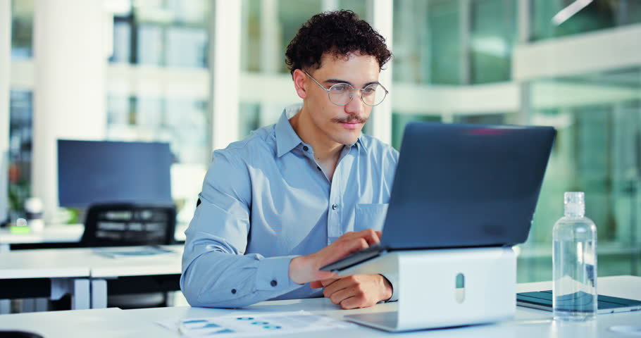 Celebration, fist pump and man with laptop in office excited for funding opportunity and good news. Reading, email and happy for business growth with investment, success and person with technology